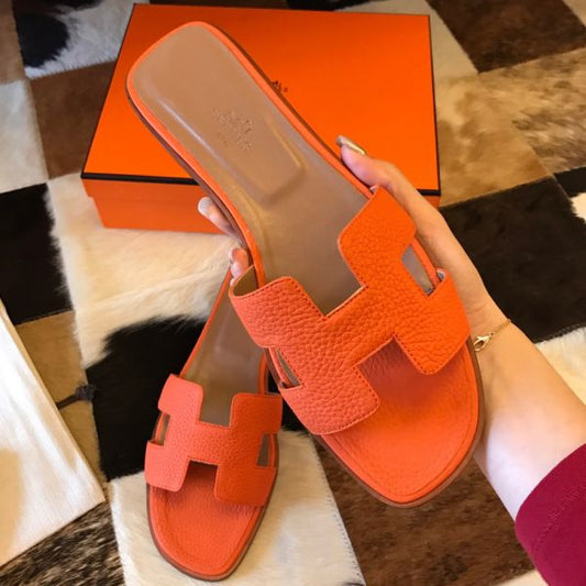 HERM Oran Slide Sandals In Orange Clemence Leather