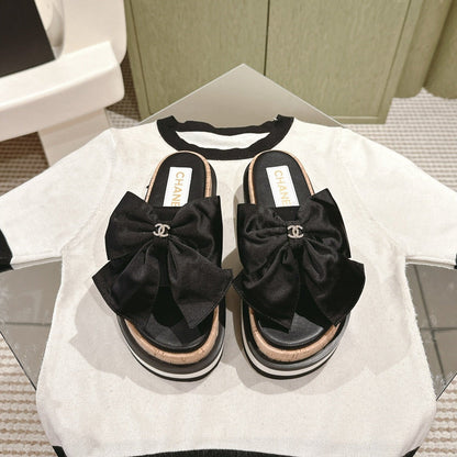 CC SLIPPERS WITH SILK BOW IN BLACK COWHIDE